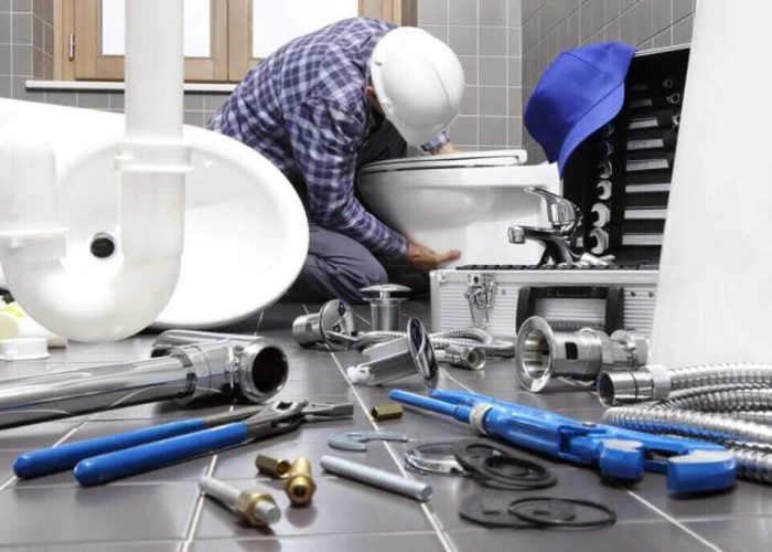 plumber-at-work-in-a-bathroom-1024x683-1